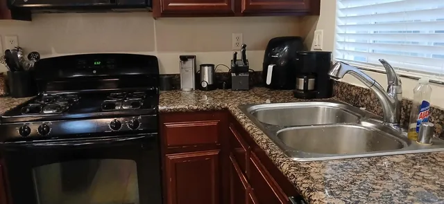 a kitchen with a sink and cabinets