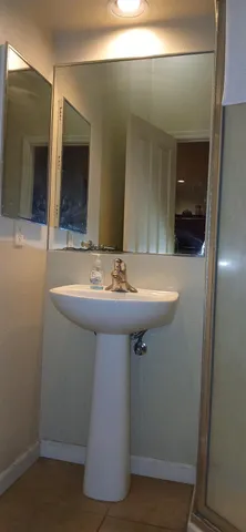 a bathroom with a sink and a mirror