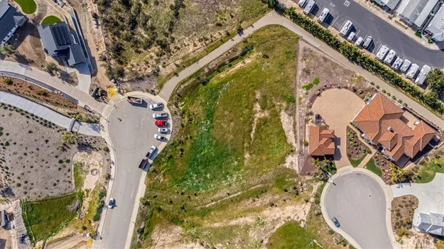 an aerial view of a house with a swimming pool