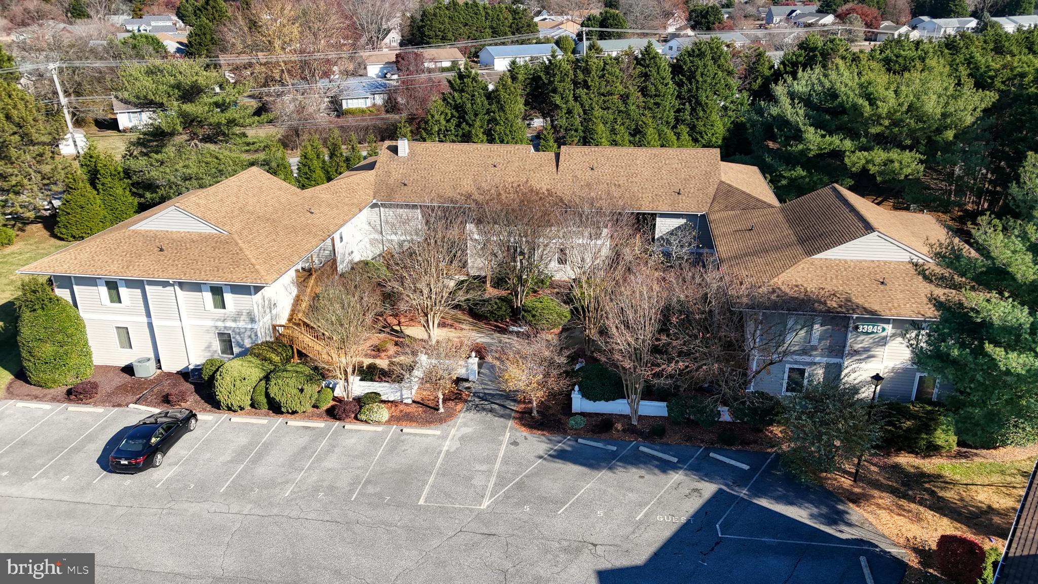 33945 Middleton Circle, Unit 1 Lewes, DE 19958 - Photo 2 of 45 an aerial view of a house with garden space and street view