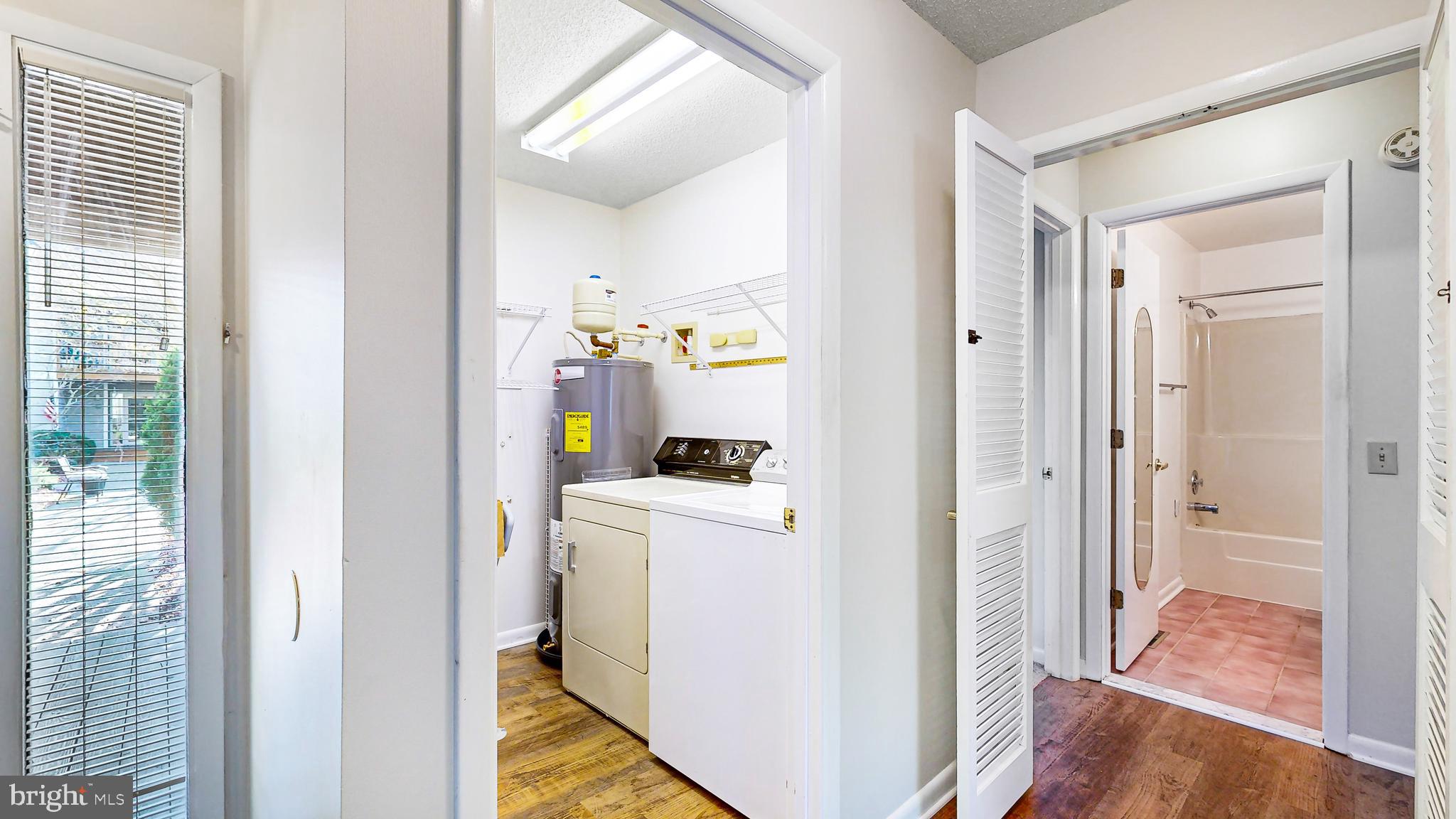 33945 Middleton Circle, Unit 1 Lewes, DE 19958 - Photo 27 of 45 a view of a hallway with bathroom and wooden floor