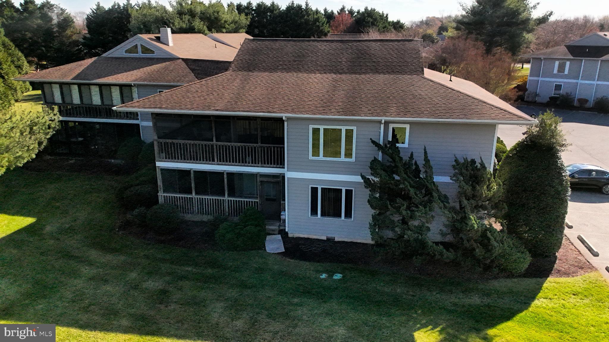 33945 Middleton Circle, Unit 1 Lewes, DE 19958 - Photo 41 of 45 a aerial view of a house with garden space and sitting area
