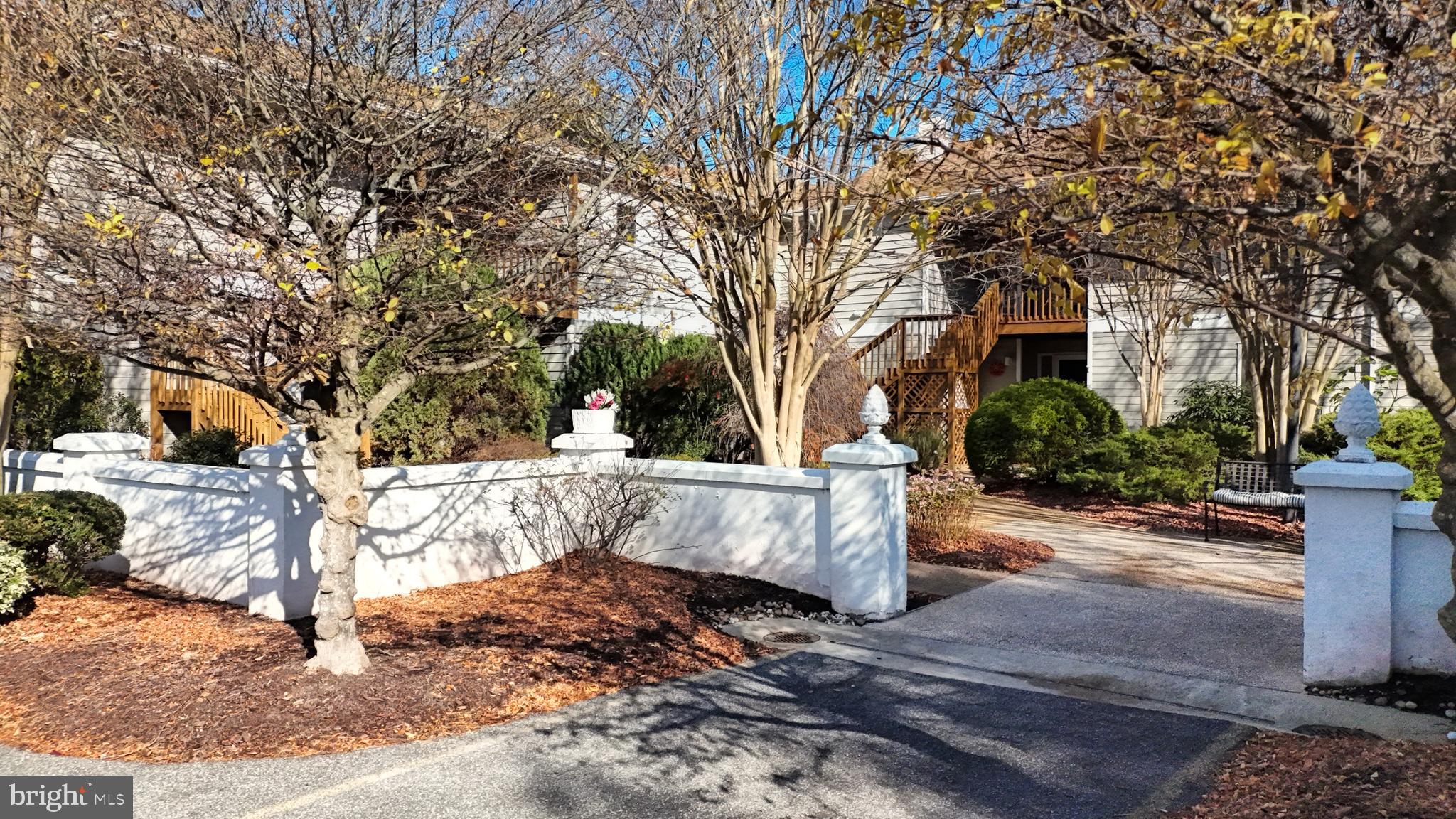33945 Middleton Circle, Unit 1 Lewes, DE 19958 - Photo 7 of 45 a view of house with trees in the background