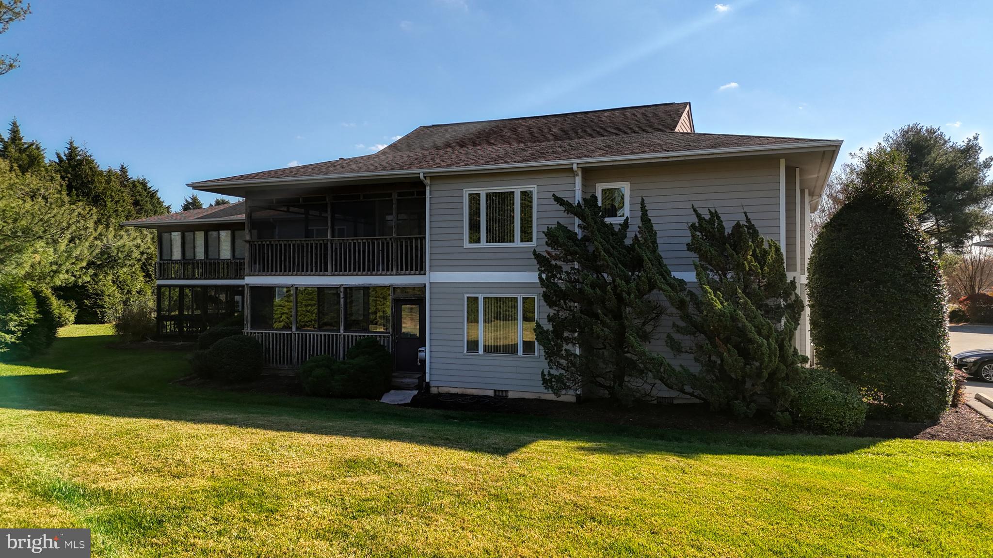 33945 Middleton Circle, Unit 1 Lewes, DE 19958 - Photo 9 of 45 a front view of a house with garden