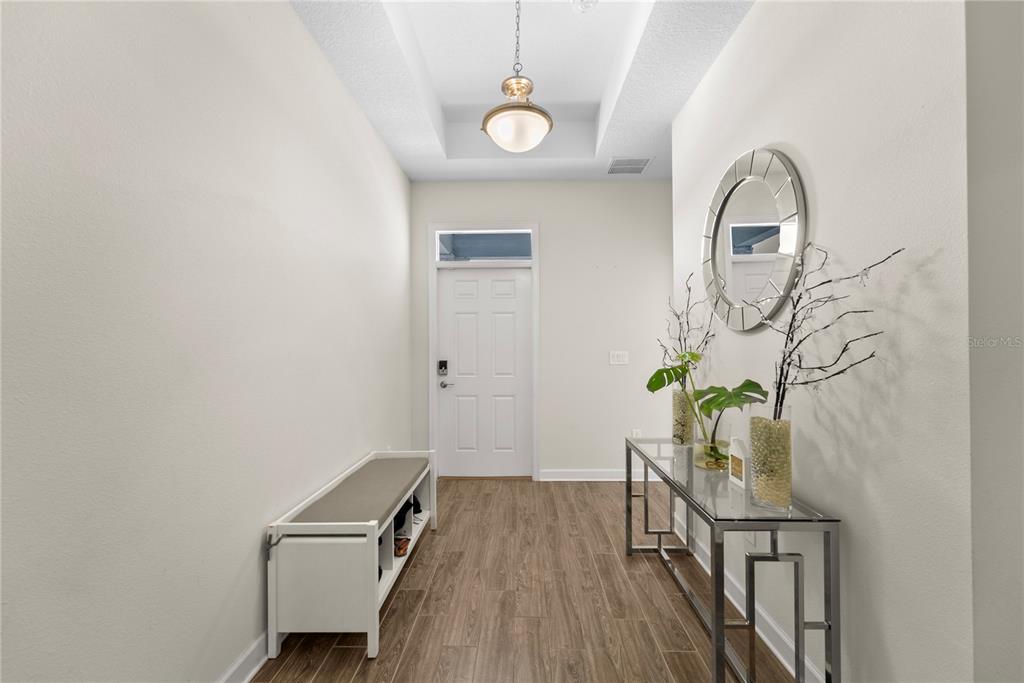 2926 Wordsmith Road Kissimmee, FL 34746 - Photo 3 of 42 wooden floor with a potted plant on it