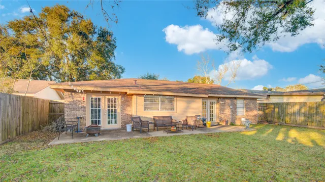 a view of a house with backyard porch and patio