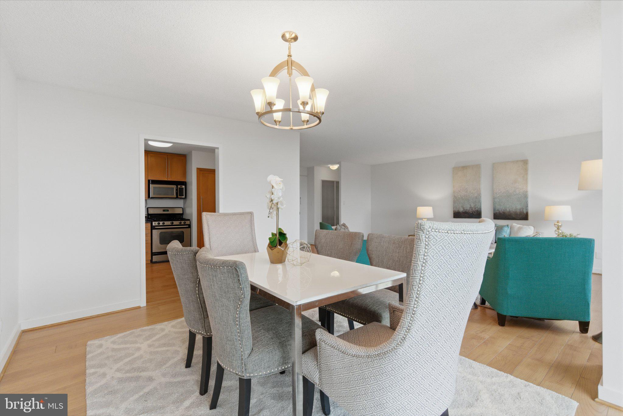 5225 Pooks Hill Road, Unit 1323S Bethesda, MD 20814 - Photo 13 of 39 a view of a dining room with furniture and wooden floor