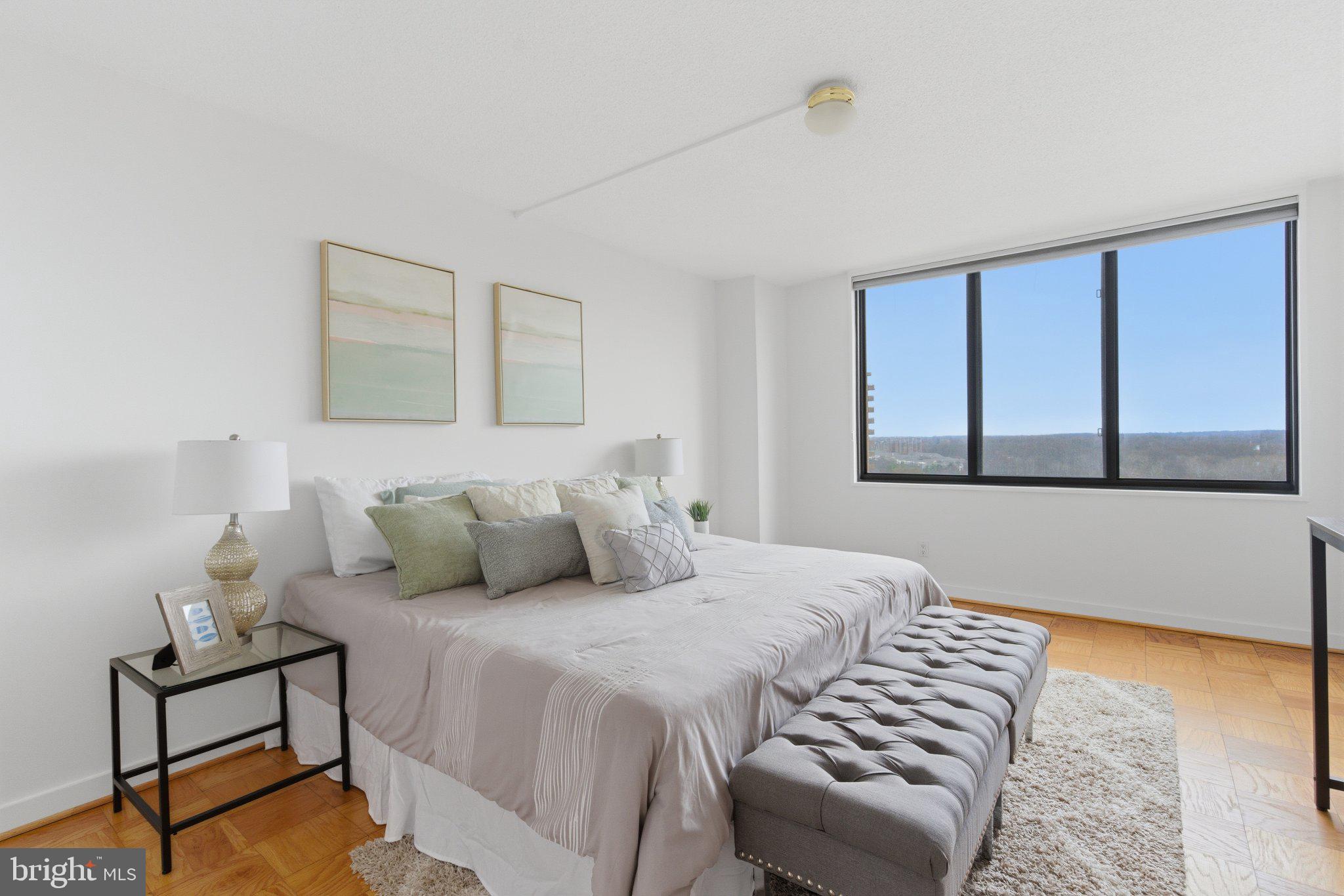 5225 Pooks Hill Road, Unit 1323S Bethesda, MD 20814 - Photo 20 of 39 a bedroom with a bed and window