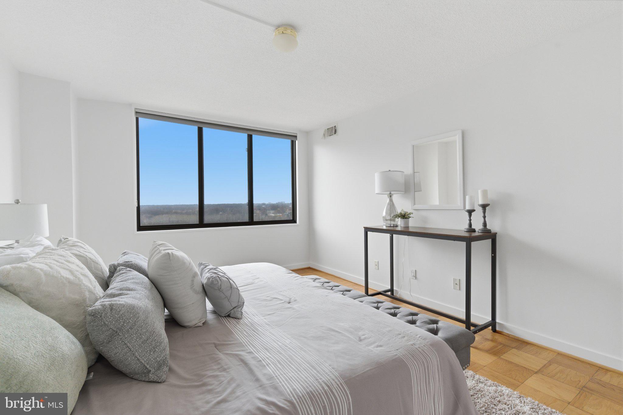 5225 Pooks Hill Road, Unit 1323S Bethesda, MD 20814 - Photo 21 of 39 a bedroom with a bed and a window