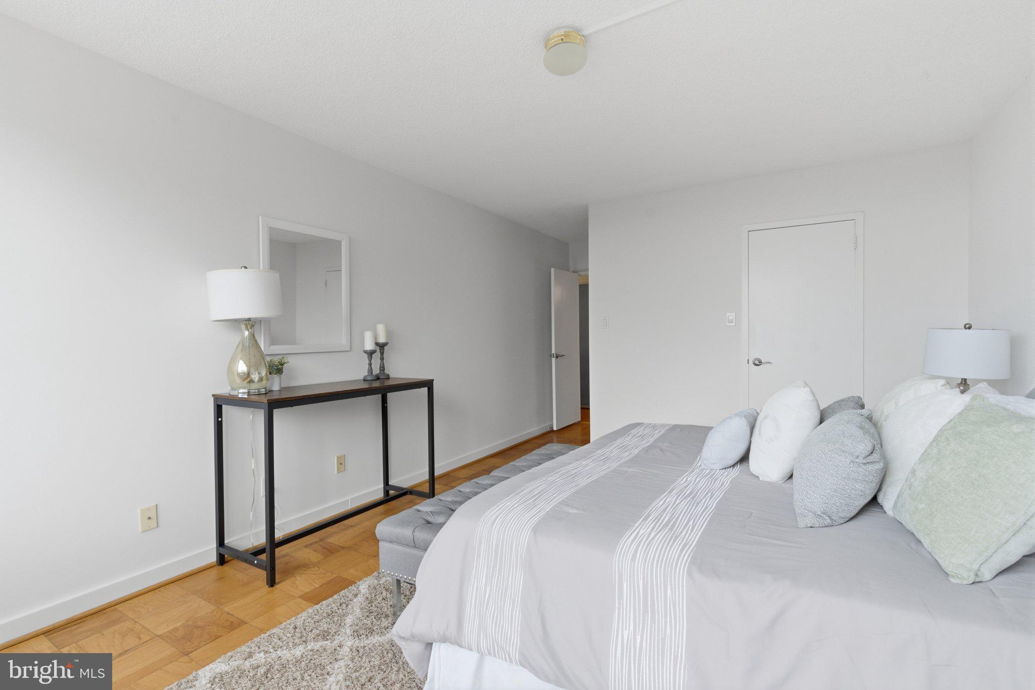 5225 Pooks Hill Road, Unit 1323S Bethesda, MD 20814 - Photo 23 of 39 a bedroom with a bed and a window