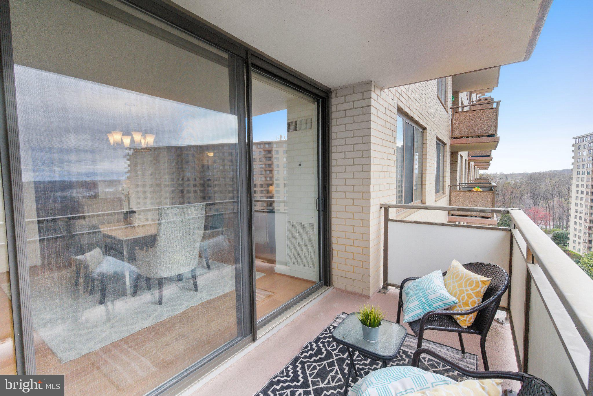 5225 Pooks Hill Road, Unit 1323S Bethesda, MD 20814 - Photo 28 of 39 a balcony with furniture and a potted plant