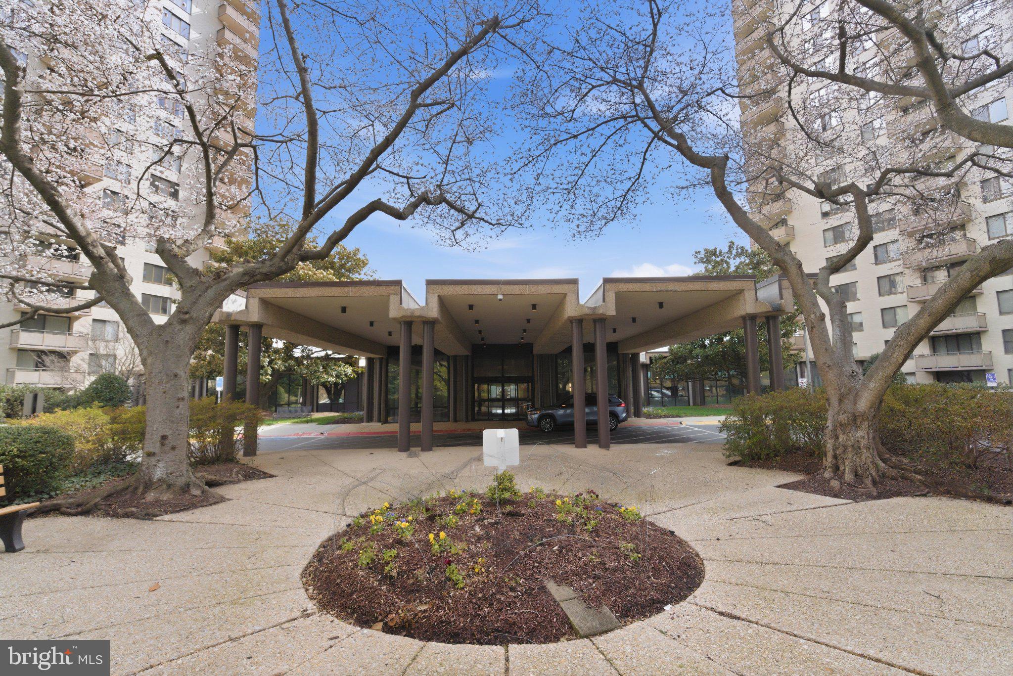 5225 Pooks Hill Road, Unit 1323S Bethesda, MD 20814 - Photo 3 of 39 a view of a building with a tree