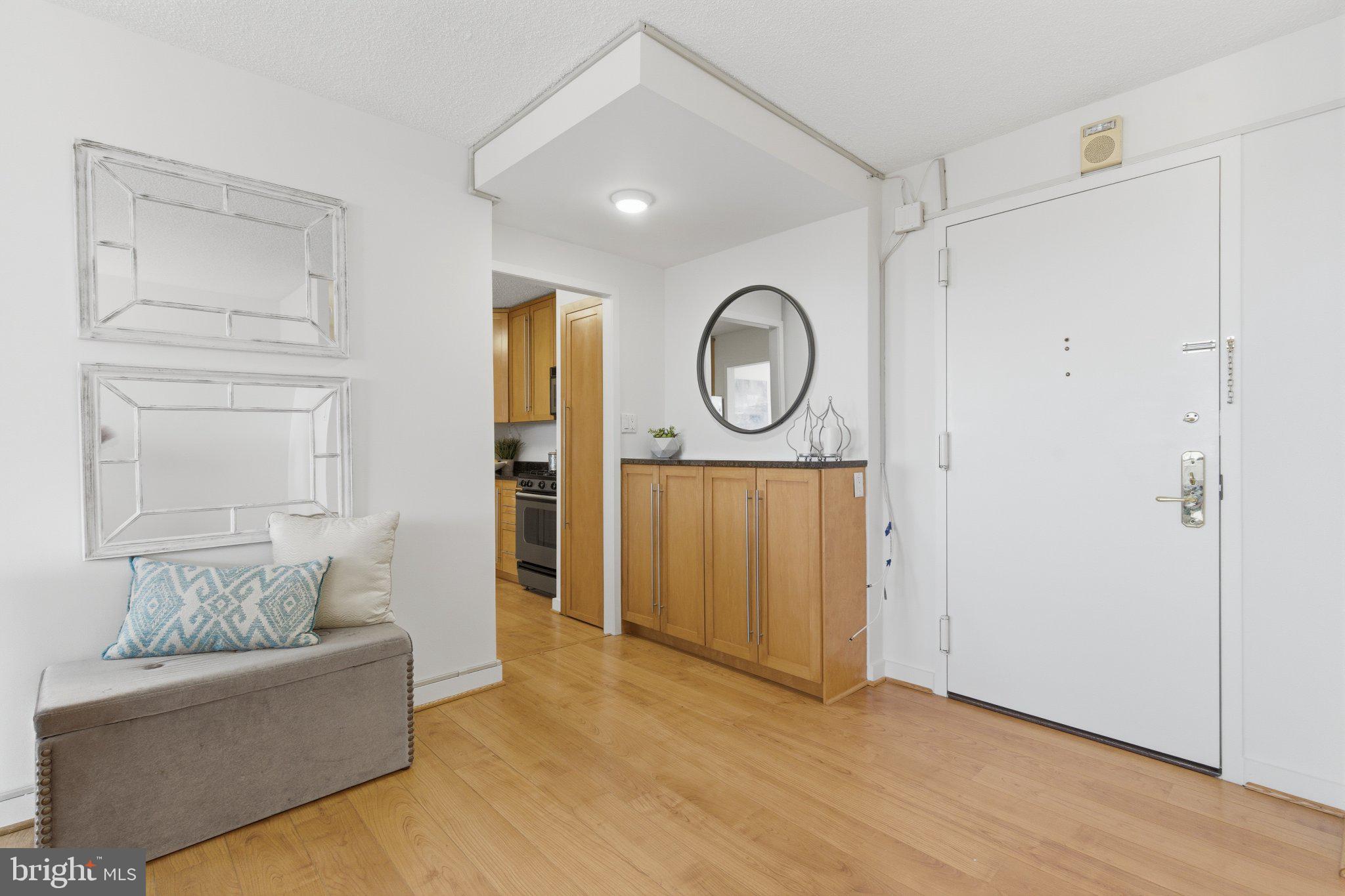5225 Pooks Hill Road, Unit 1323S Bethesda, MD 20814 - Photo 6 of 39 a living room with furniture and a window