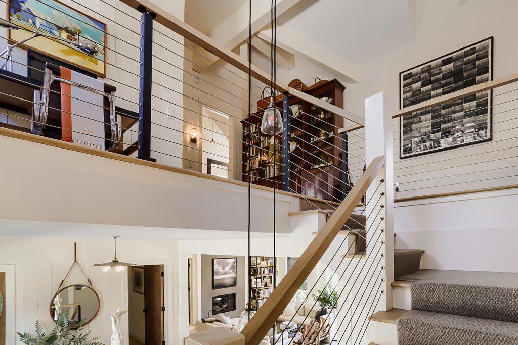 9 Ridge Hill Road Chilmark, MA 02535 - Photo 22 of 48 a view of staircase with lots of frames on wall and a window