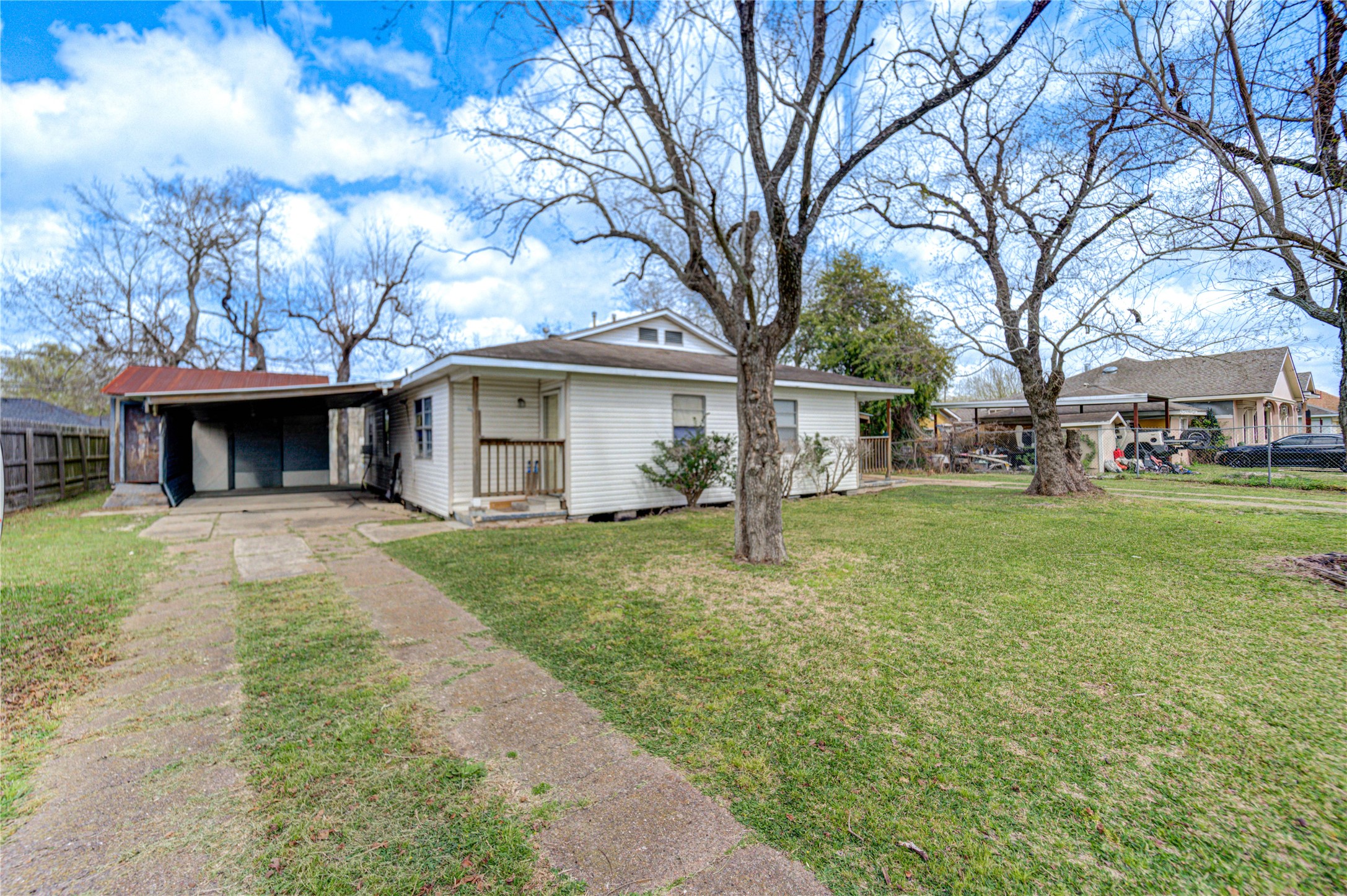 6109 Hertford Street Houston, TX 77048 - Photo 24 of 34 a front view of a house with a yard and trees