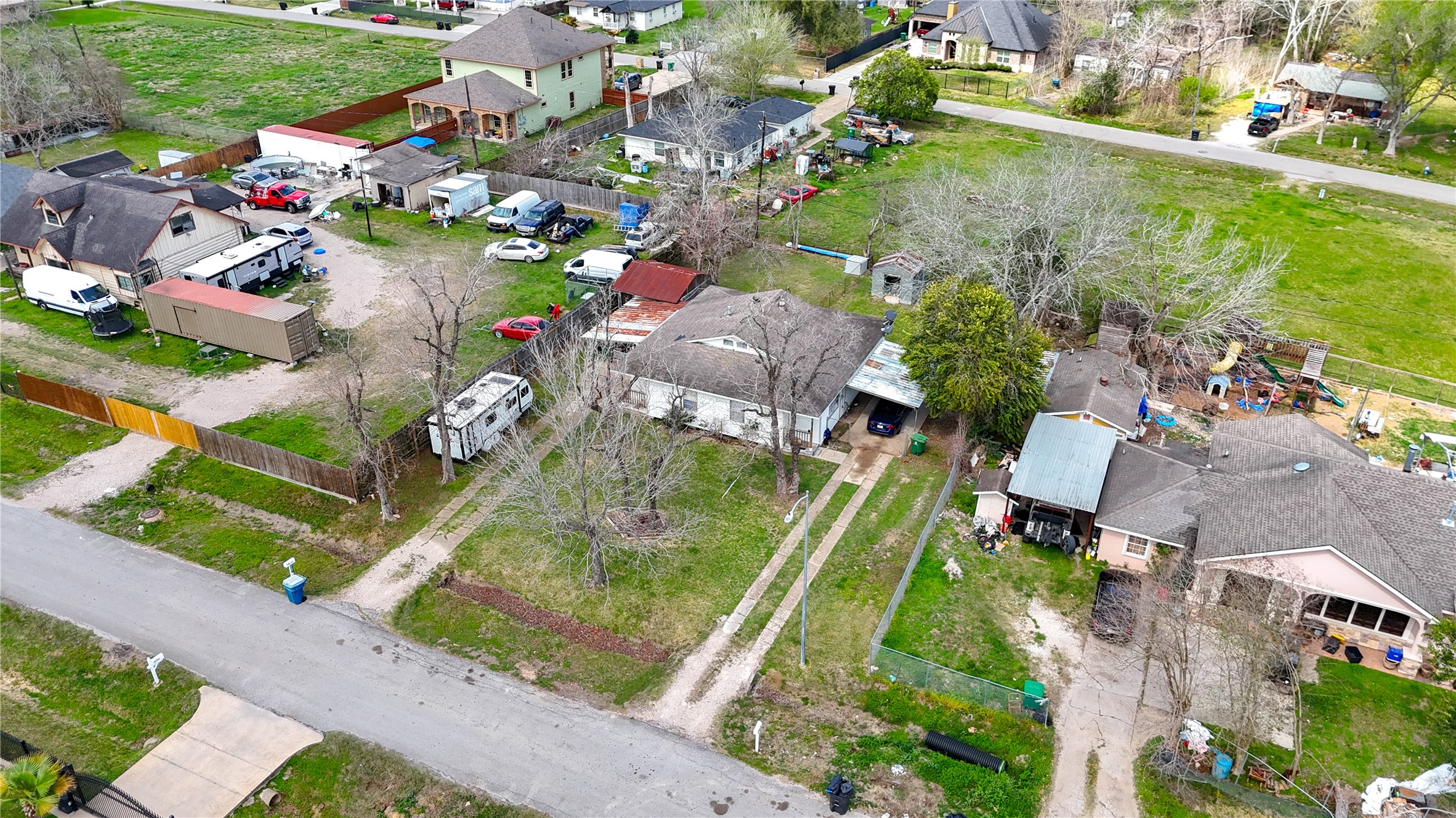 6109 Hertford Street Houston, TX 77048 - Photo 6 of 34 an aerial view of a house with a garden and lake view