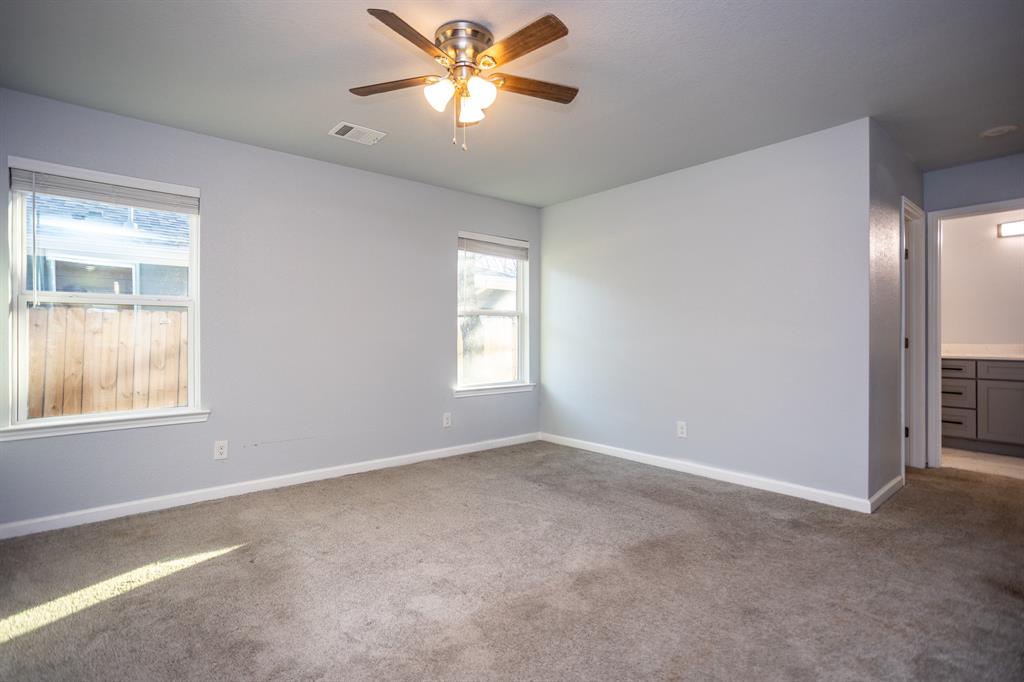815 Ritchey Street Gainesville, TX 76240 - Photo 7 of 18 a view of an empty room with a window