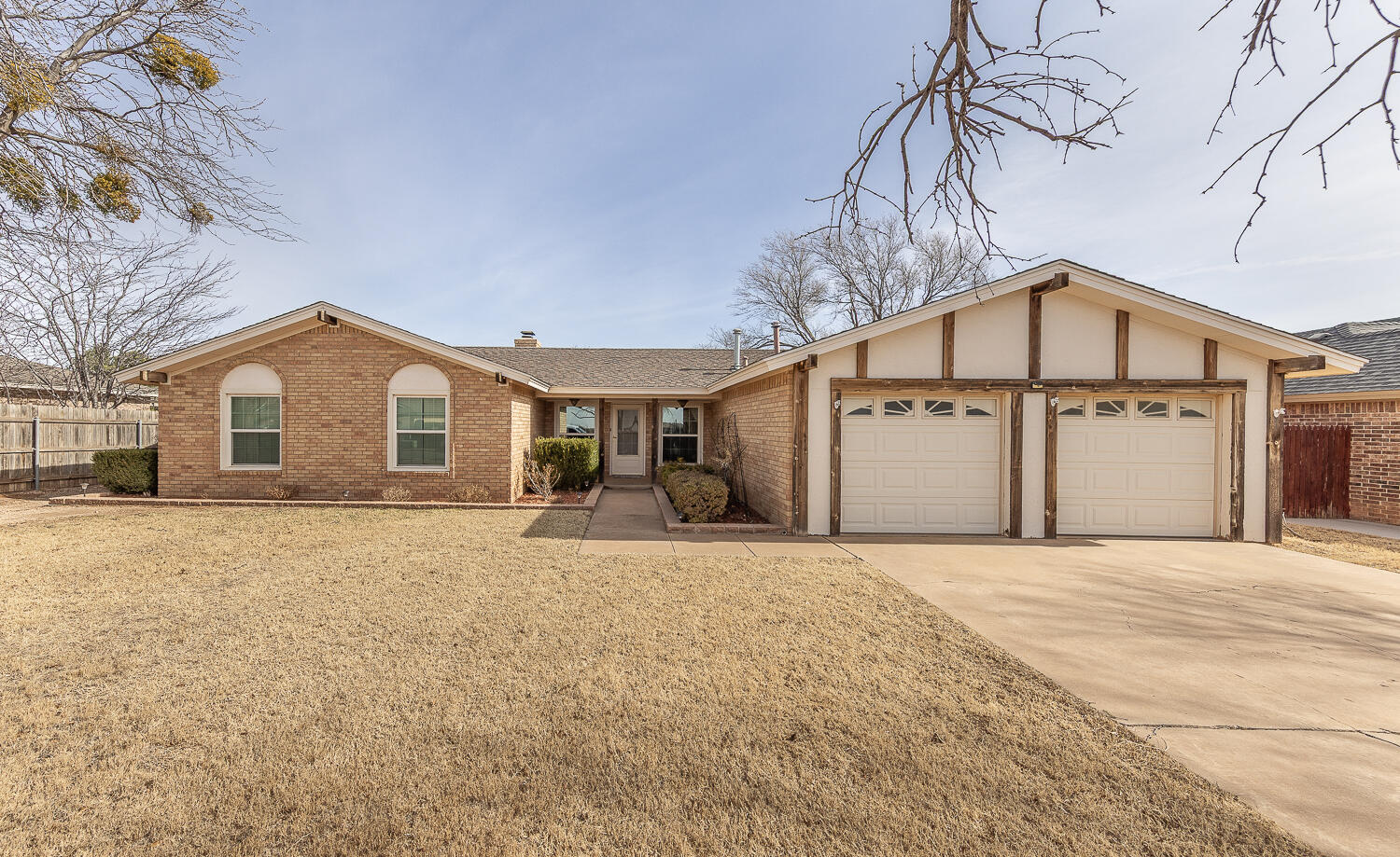 a view of a house with a yard and garage