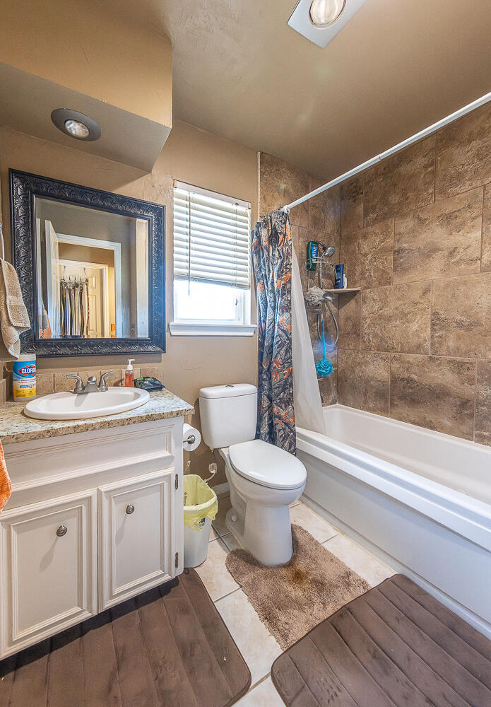 6 Ridge Road Ransom Canyon, TX 79366 - Photo 16 of 31 a bathroom with a sink toilet and shower