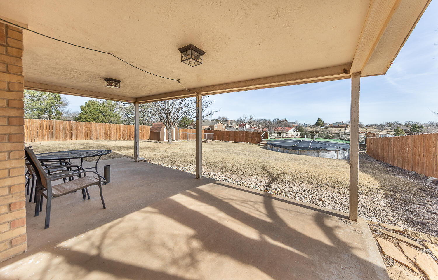 6 Ridge Road Ransom Canyon, TX 79366 - Photo 22 of 31 a view of a balcony with table and chairs