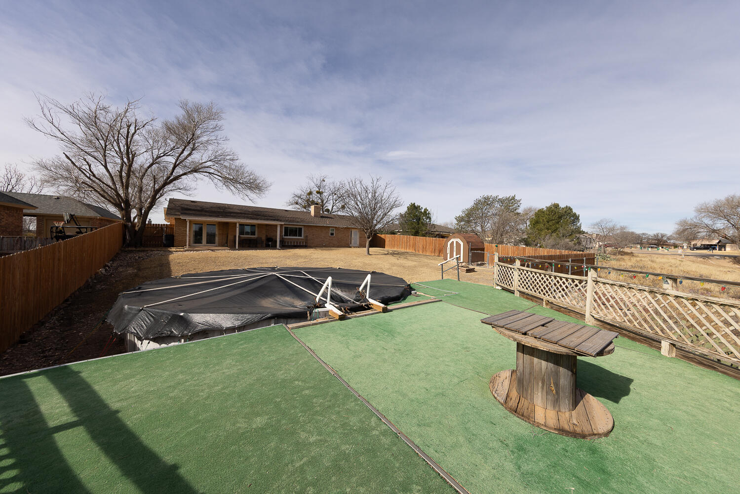 6 Ridge Road Ransom Canyon, TX 79366 - Photo 27 of 31 a view of a house with backyard outdoor seating and green space