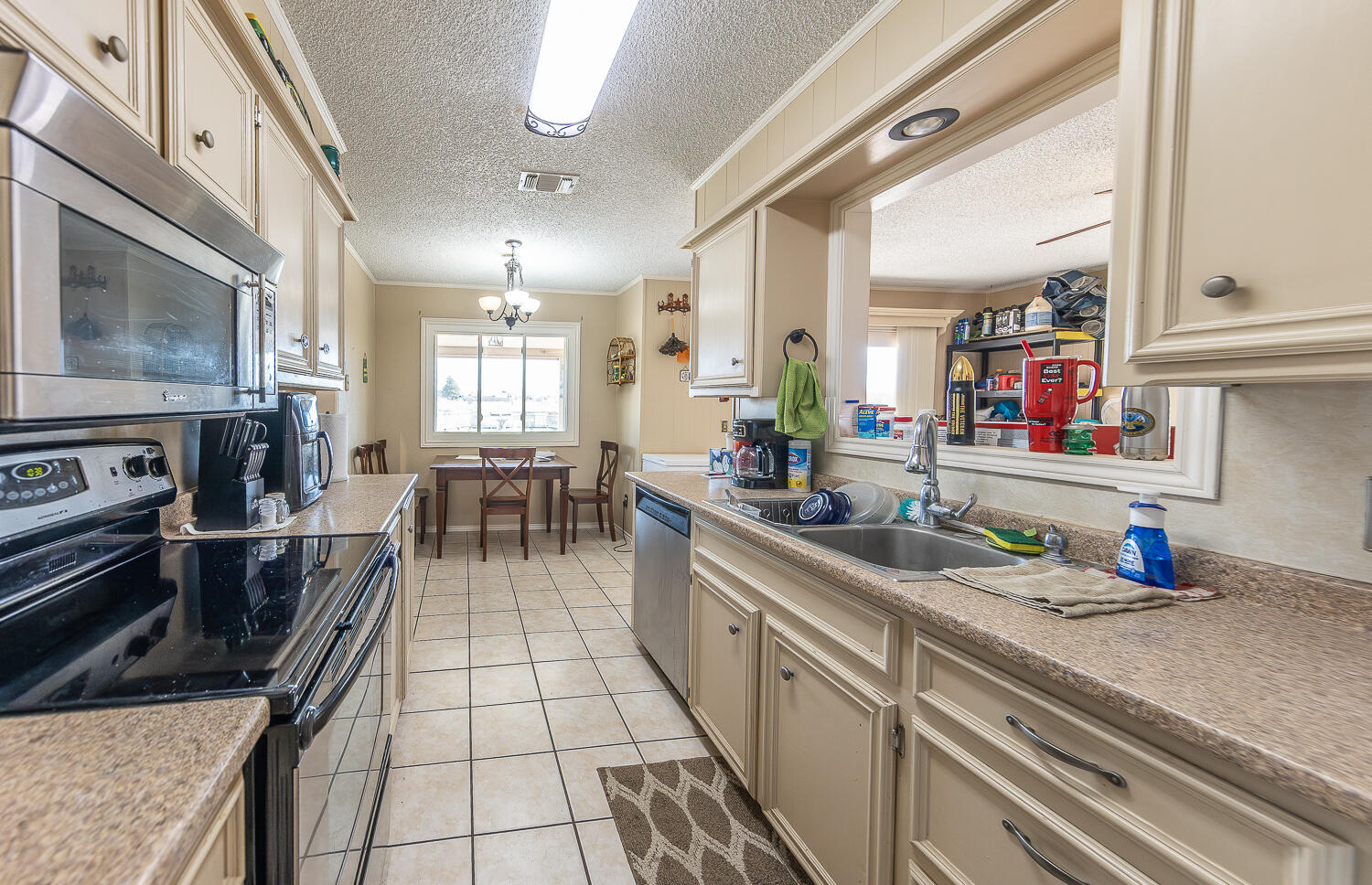 6 Ridge Road Ransom Canyon, TX 79366 - Photo 3 of 31 a kitchen with stainless steel appliances a sink stove and cabinets