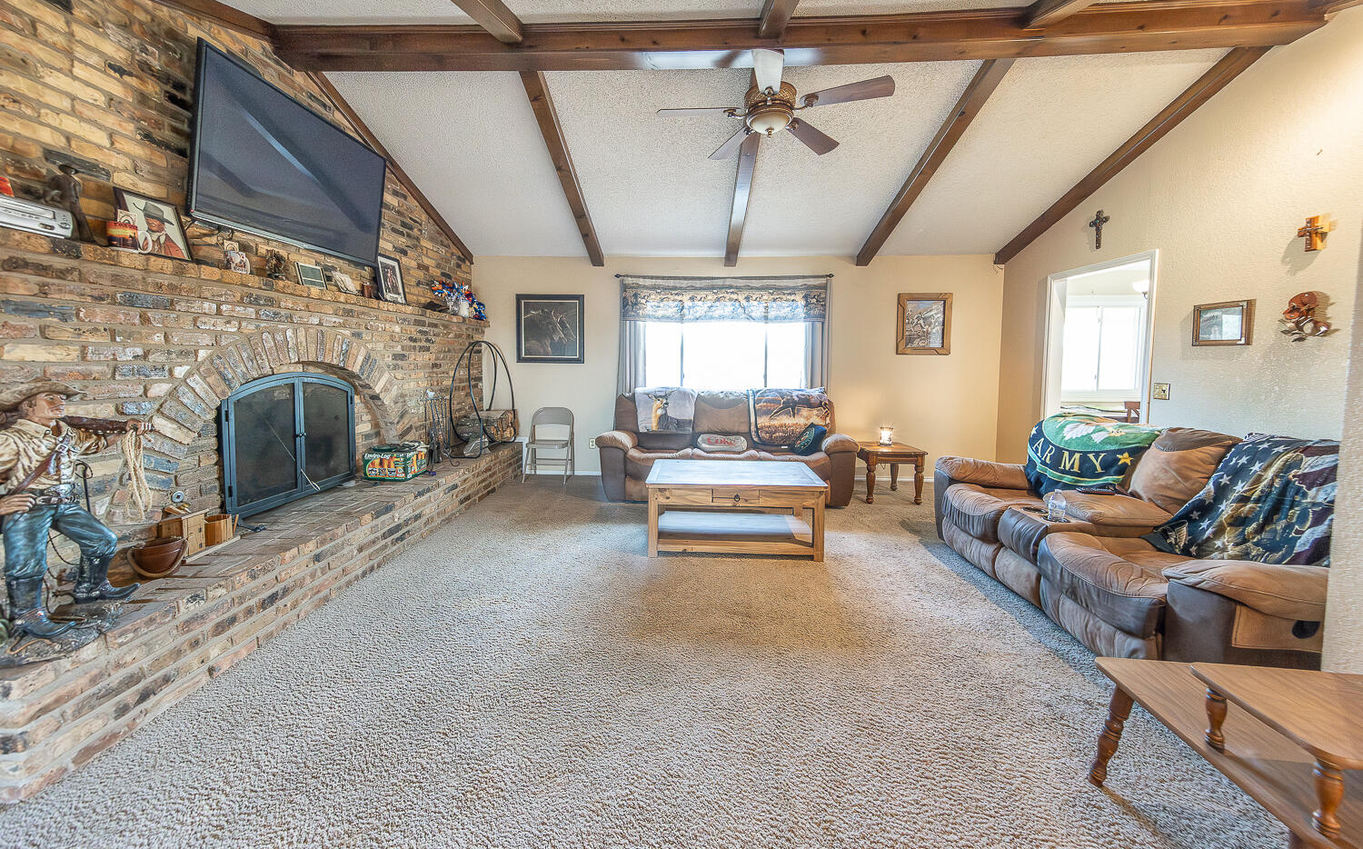 6 Ridge Road Ransom Canyon, TX 79366 - Photo 5 of 31 a living room with furniture and a fireplace