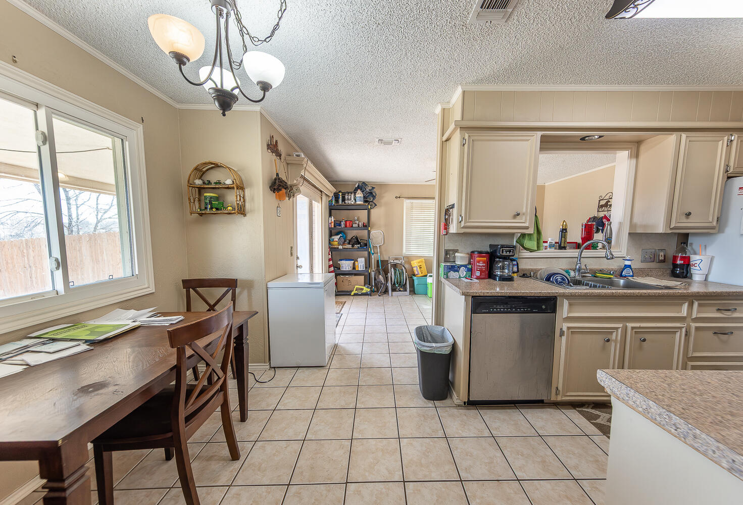 6 Ridge Road Ransom Canyon, TX 79366 - Photo 7 of 31 a kitchen with cabinets and chairs