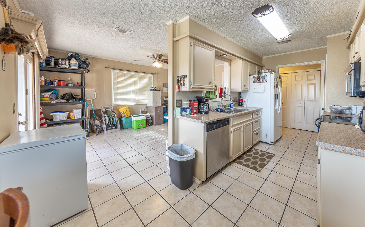 6 Ridge Road Ransom Canyon, TX 79366 - Photo 8 of 31 a kitchen with a sink and a stove top oven