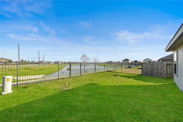 a view of a golf course with a lake view