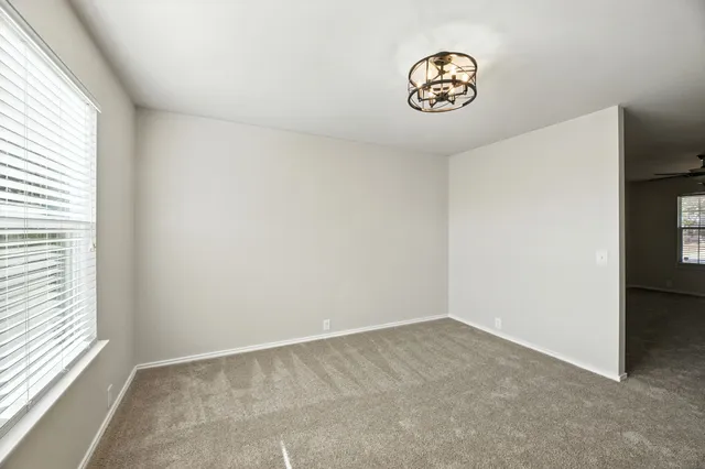 a view of a storage & utility room with window