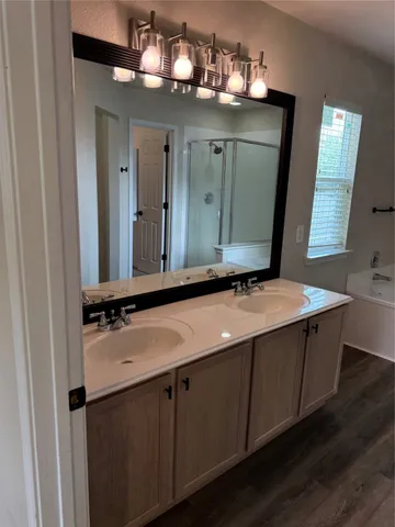 a bathroom with a tub and shower