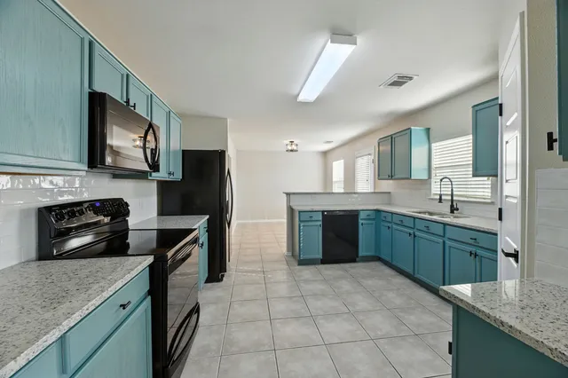 a view of a kitchen with a sink