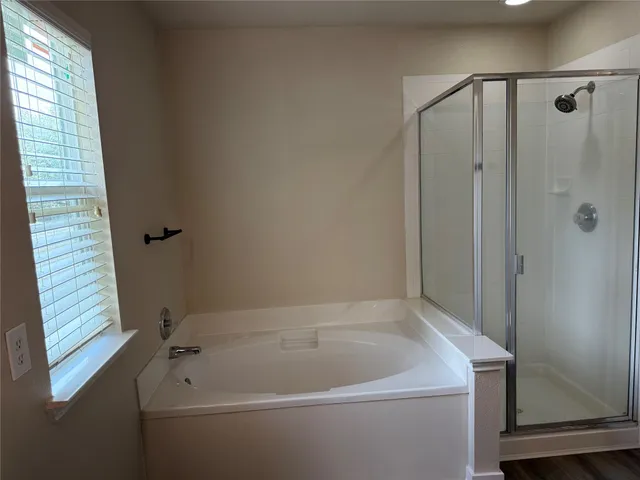 an empty room with a empty space and windows