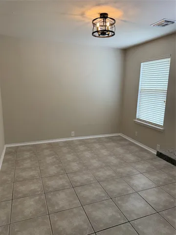 a view of empty room with windows