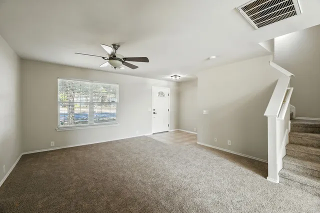 a view of an empty room with a window