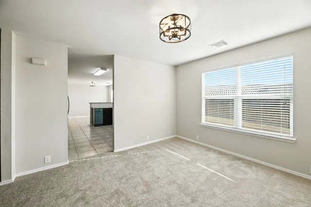 a kitchen with stainless steel appliances granite countertop a sink and a refrigerator