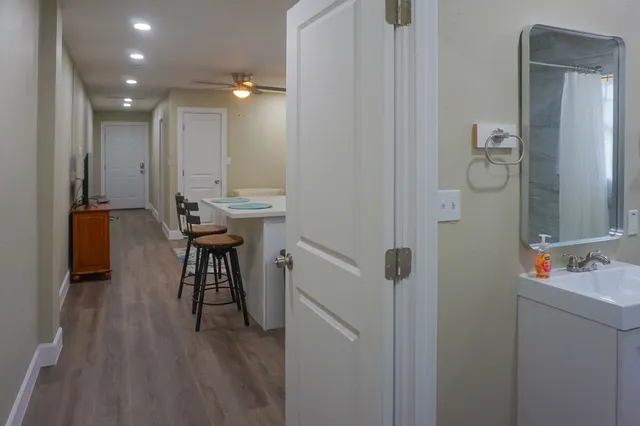 a view of kitchen with furniture and wooden floor