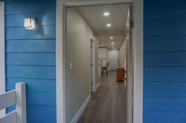 a view of a hallway with a room