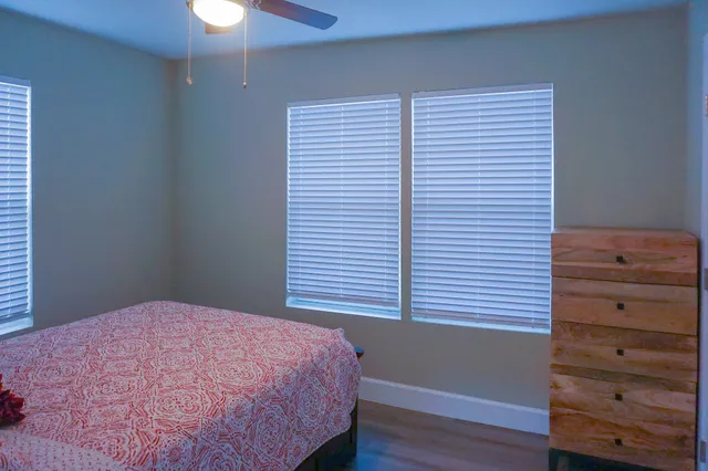 a bedroom with a bed and a dresser