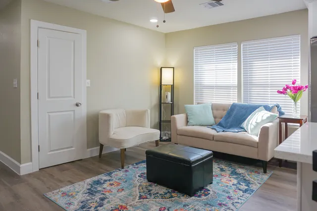 a living room with furniture and a window
