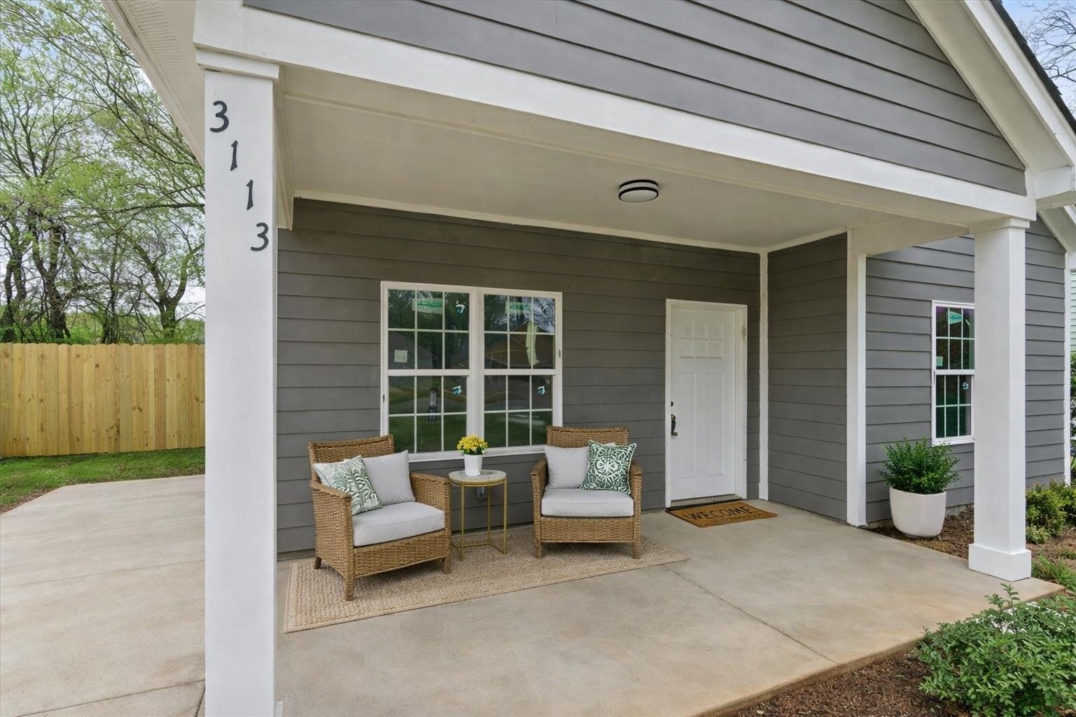 3113 Allison Avenue Memphis, TN 38112 - Photo 2 of 24 a balcony with furniture and a potted plant
