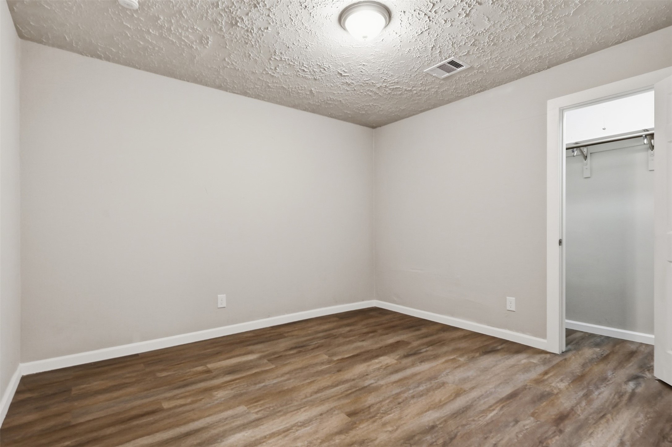 4767 Beechaven Street Houston, TX 77053 - Photo 22 of 26 a view of empty room with wooden floor