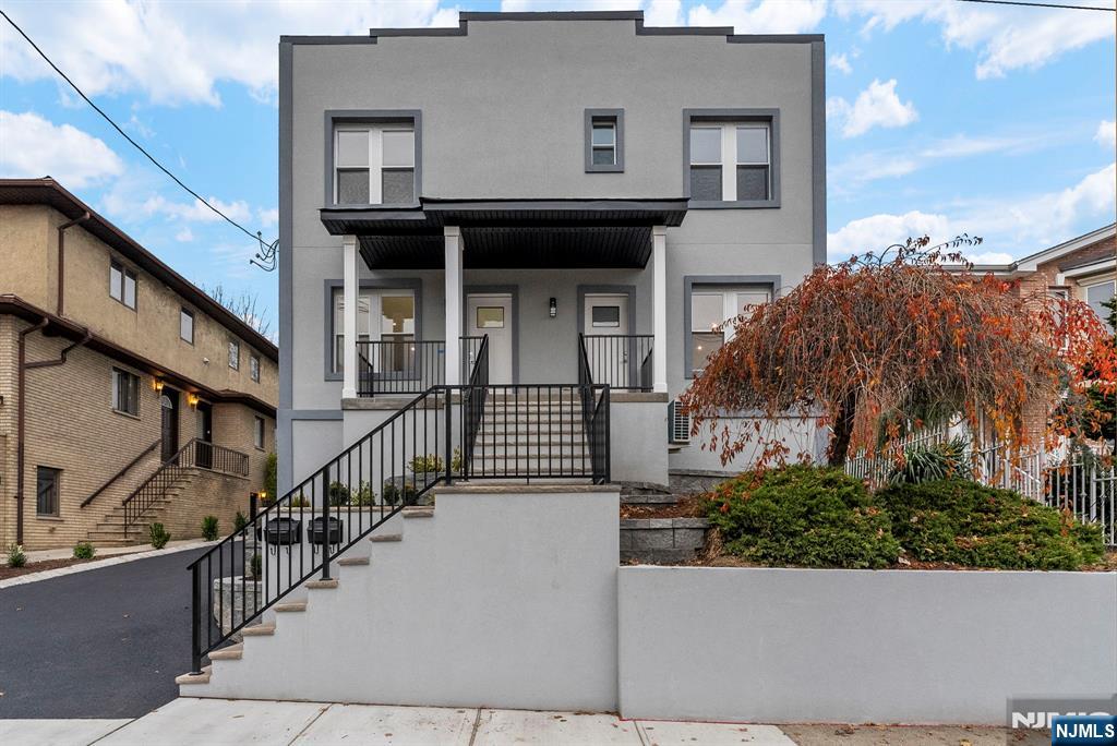 743 Kingsland Avenue, Unit 1 Ridgefield, NJ 07657 - Photo 2 of 27 a view of a house with wooden fence