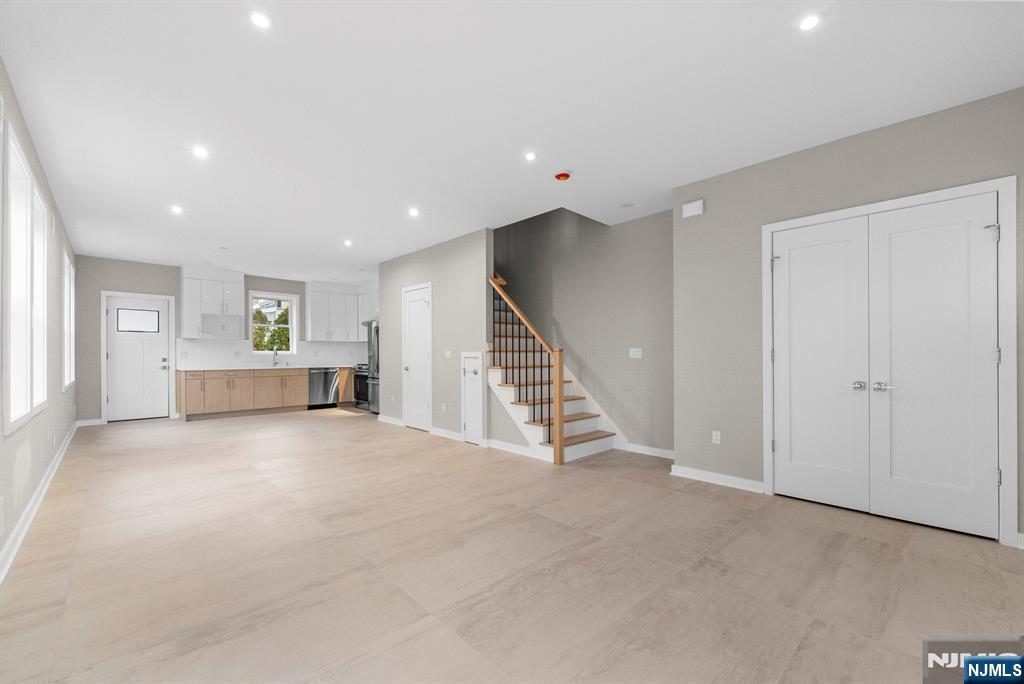 743 Kingsland Avenue, Unit 1 Ridgefield, NJ 07657 - Photo 4 of 27 a view of an empty room with stairs and ventilation