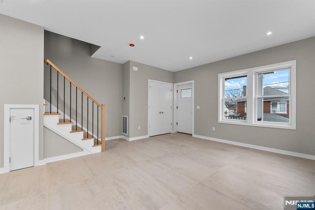 743 Kingsland Avenue, Unit 1 Ridgefield, NJ 07657 - Photo 5 of 27 a view of an empty room with a window