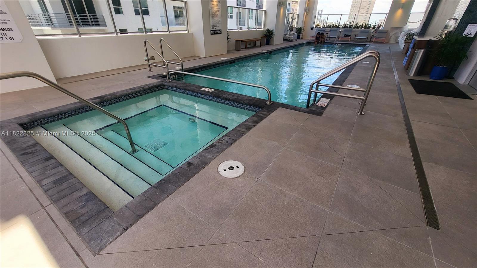 227 Northeast 2nd Street, Unit 2907 Miami, FL 33132 - Photo 26 of 36 a view of a balcony with chairs