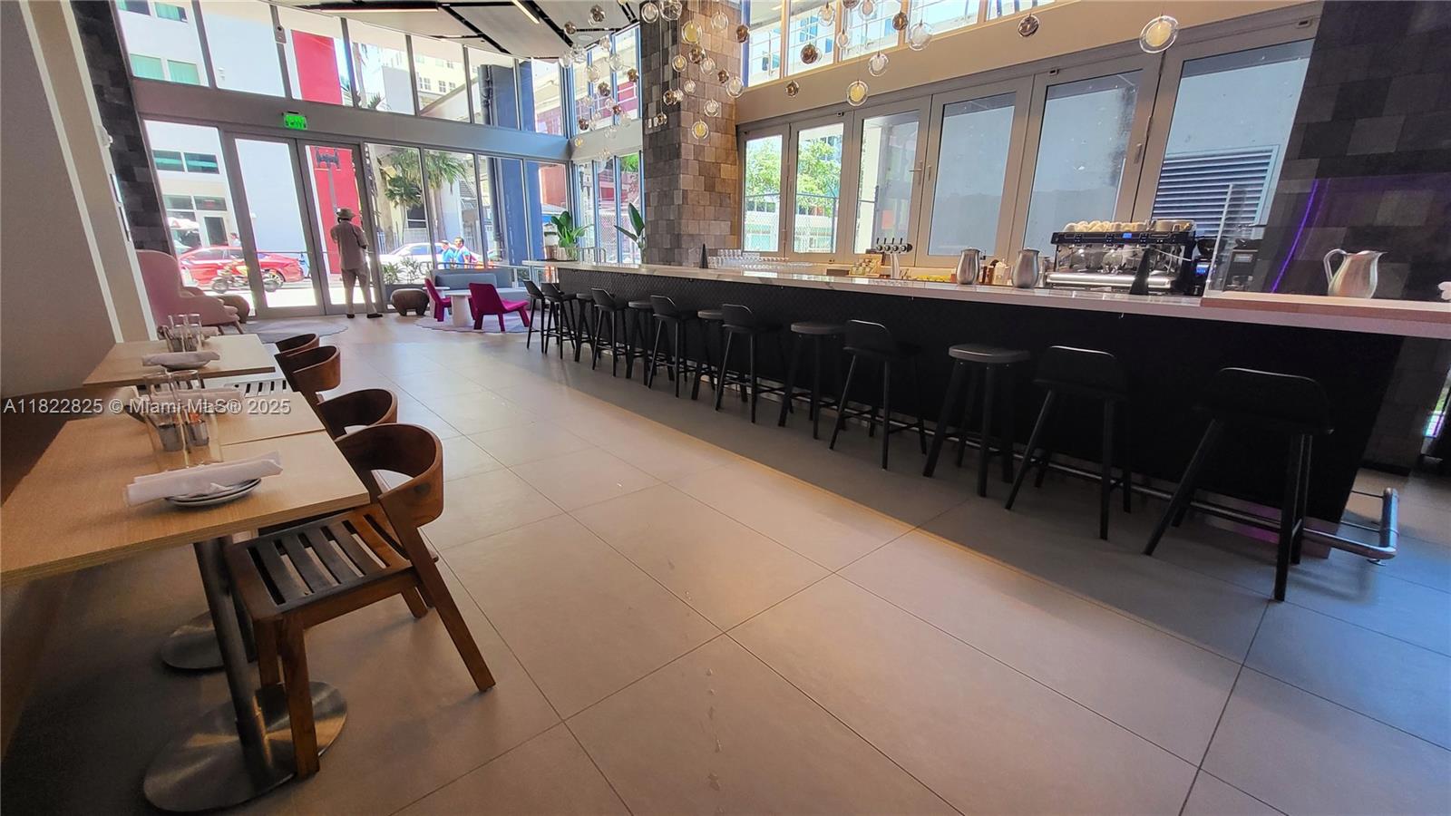 227 Northeast 2nd Street, Unit 2907 Miami, FL 33132 - Photo 27 of 36 a room with furniture and window