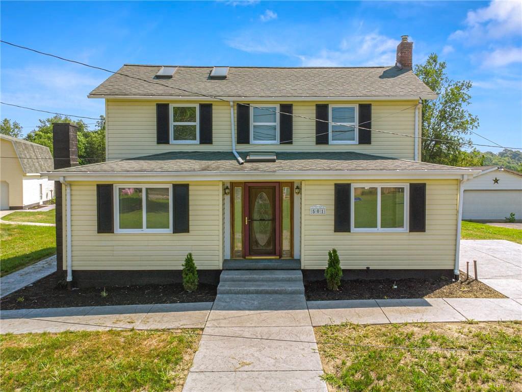 a front view of a house with large windows