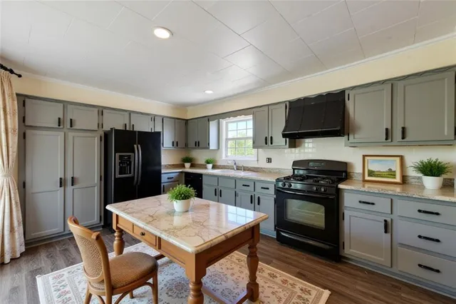 a bathroom with a sink a mirror and vanity